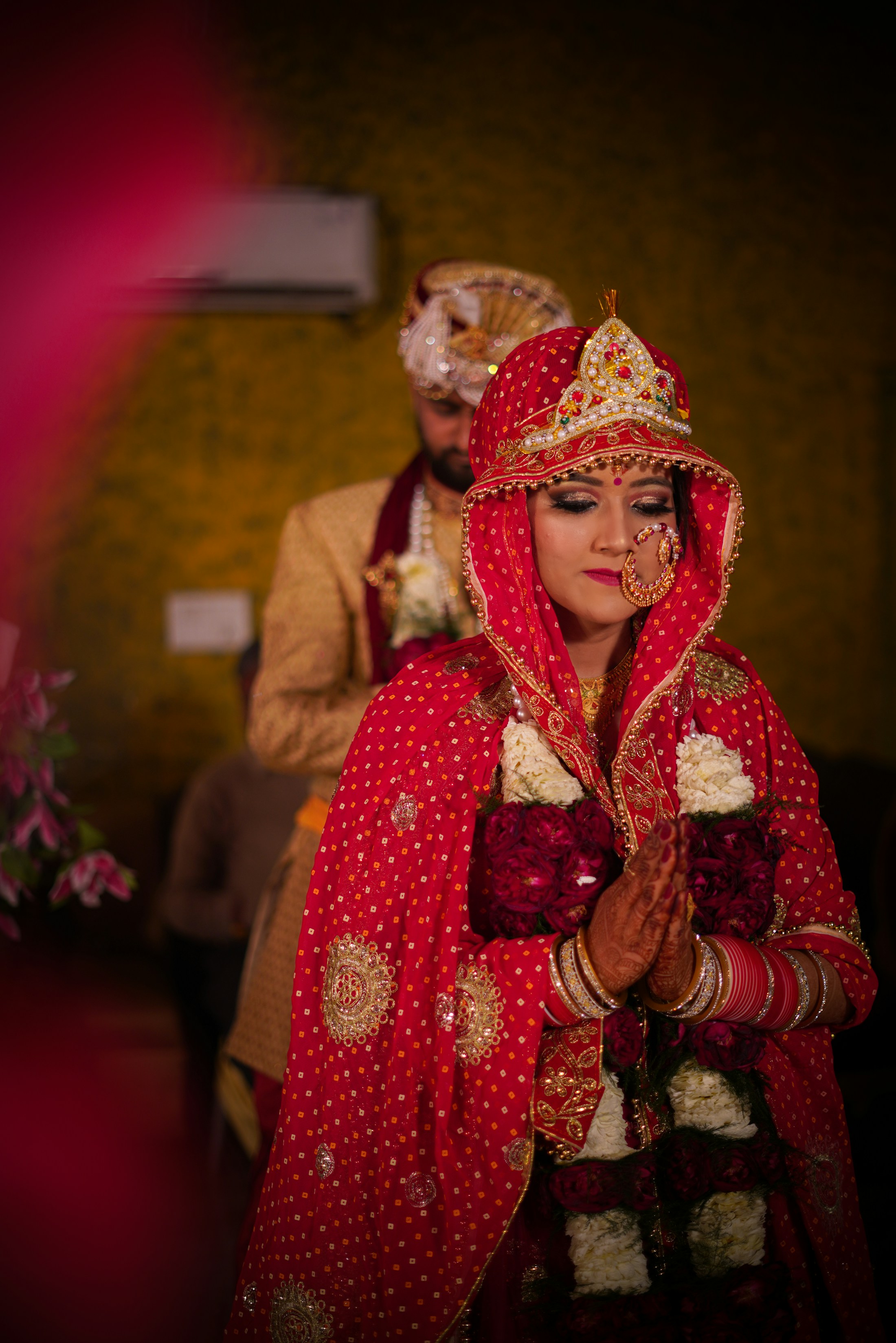 Indian bride in traditional red attire and jewellery